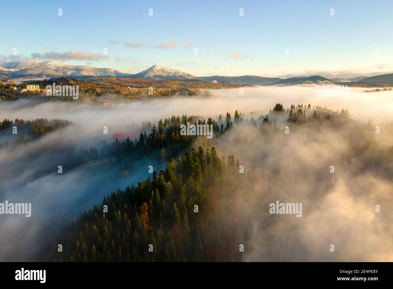 A foggy village in the carpathian mountains hi-res stock photography ...