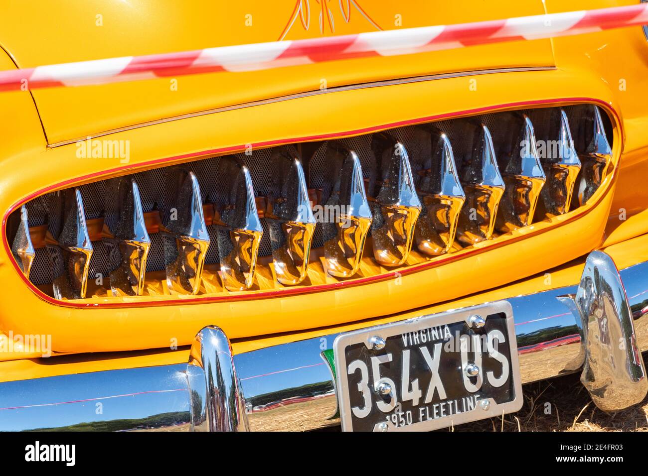 close up of chrome grille of yellow 1950 Chevrolet Fleetline custom at