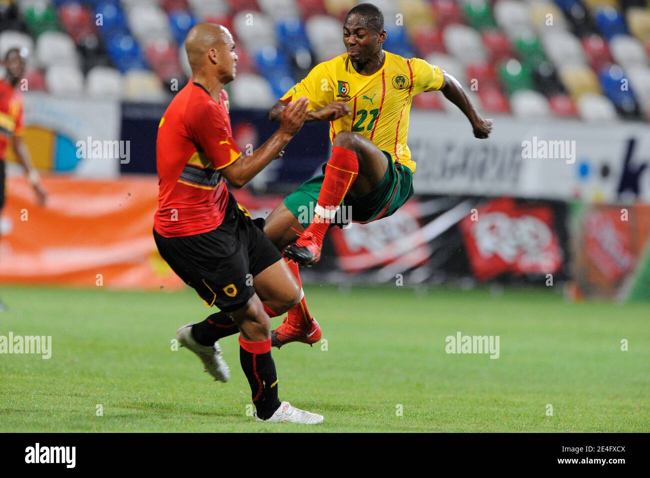 Cameroon's Enoh Eyong battles for the ball with Angola's Kali during a Friendly soccer Match, Cameroon vs Angola in Olhao, Portugal on October 14, 2009. The match ended in a 1-1 draw. Photo by Henri Szwarc/ABACAPRESS.COM Stock Photo