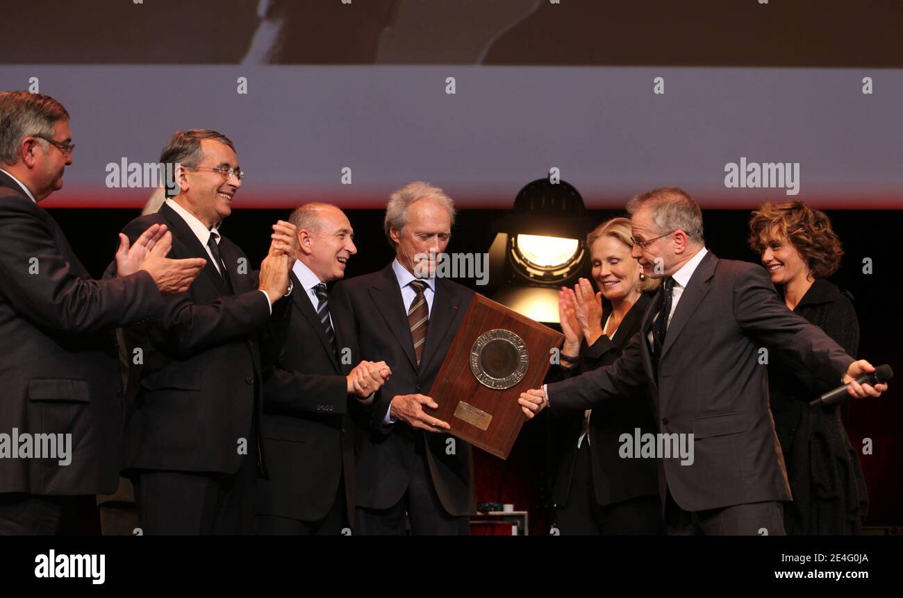 FRANCE, Lyon : US film director and actor Clint Eastwood (C) poses beside (From L) Lyon Mayor Gerard Collomb, French filmmaker Bertrand Tavernier, Swiss actress Marthe Keller and Belgian actress Cecile de France, after receiving an award for his contribution to cinema on October 17, 2009 during the first edition of the Lumiere 2009 Film Festival in Lyon, eastern France. Eastwood is the guest of honour at the city's film festival, which runs from October 13-18. Photos by Vincent Dargent/ABACAPRESS.COM Stock Photo
