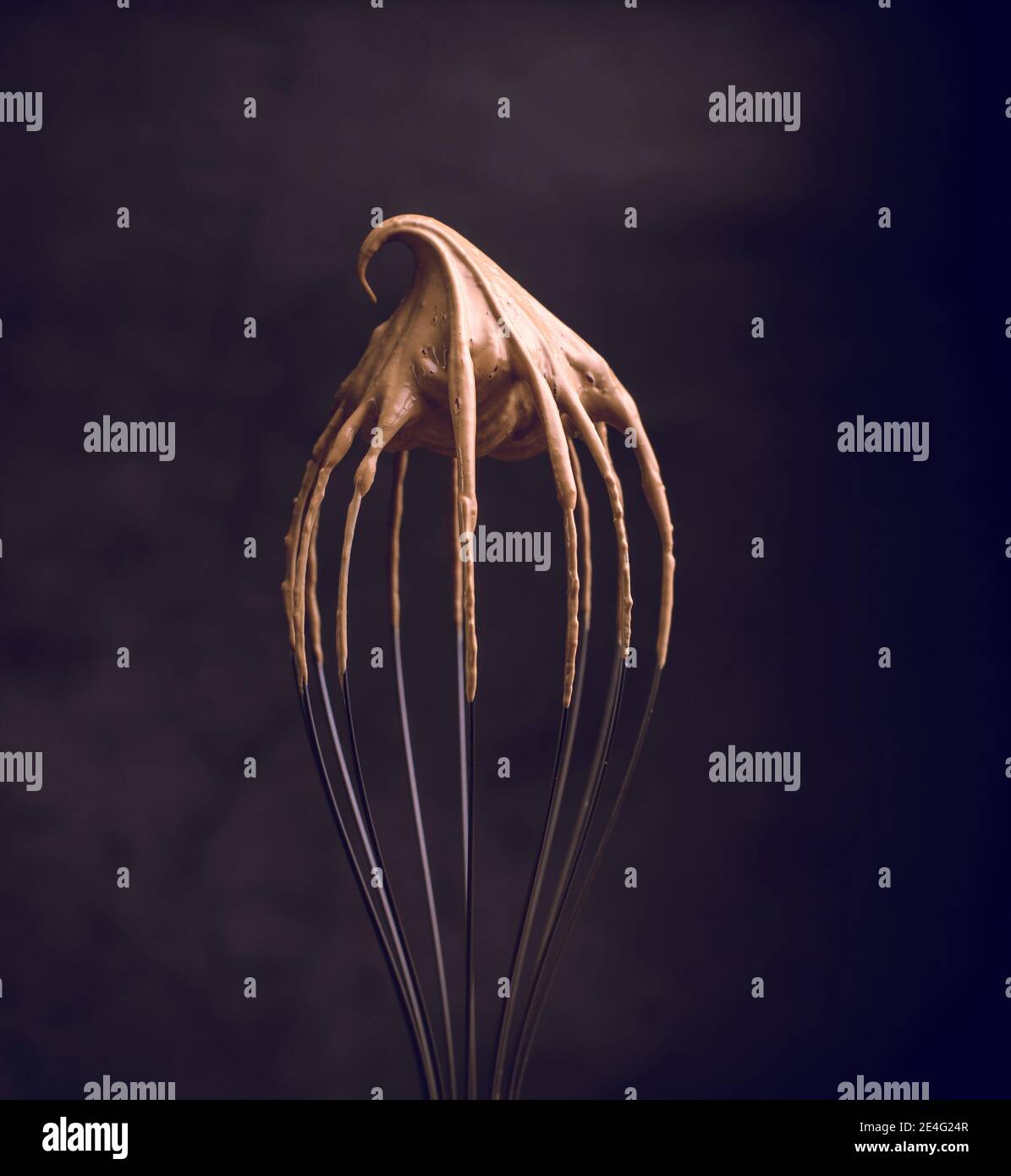 Whipped creamy instant coffee on a whisk closeup. How to cook the