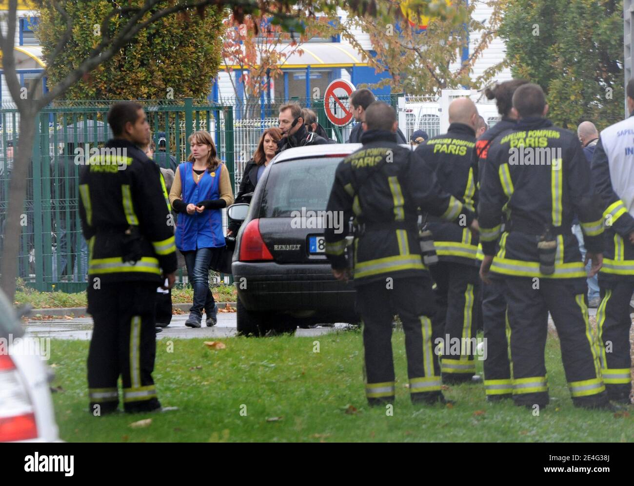 A hostage leaves the LIDL supermarket in an industrial zone in Sevran, north of Paris, October 21, 2009 after three men held people hostages were released, French police