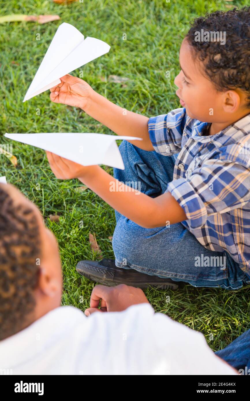 Happy African American Father and Mixed Race Son Playing with Paper ...