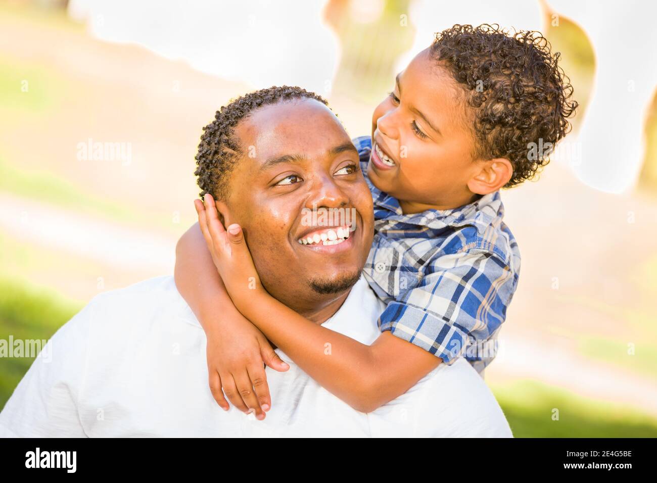 Happy African American Father and Mixed Race Son Playing At The Park ...