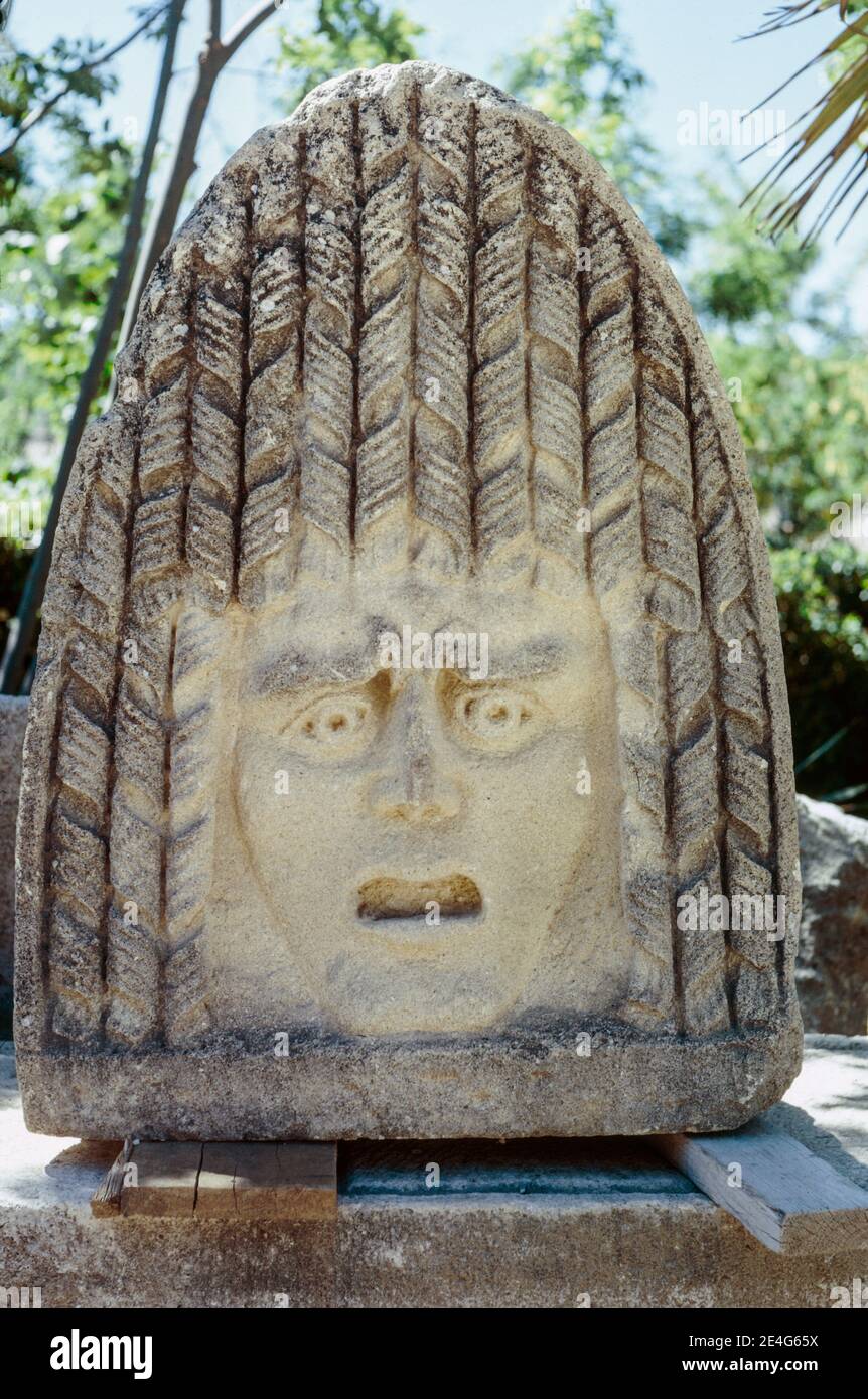 Ruins of Roman settlement in Vaison-la-Romaine, town in the Provence-Alpes-Côte d'Azur region in southeastern France. Acroterion Theatre Mask stone (Acroterium or Akroteria). Archival scan from a slide. June 1975. Stock Photo