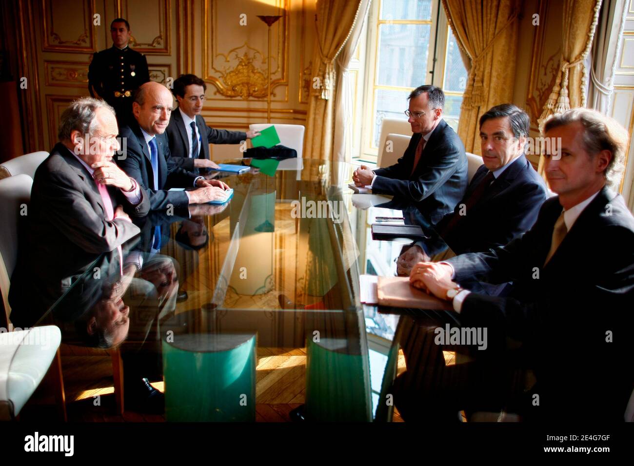 French Prime minister Francois Fillon, flanked by his cabinet director Jean-Paul  Faugere (2ndR) and his assistant Principal private secretary Antoine Gosset-Grainville  (1ndR) has a meeting with Former French Prime ministers Michel Rocard