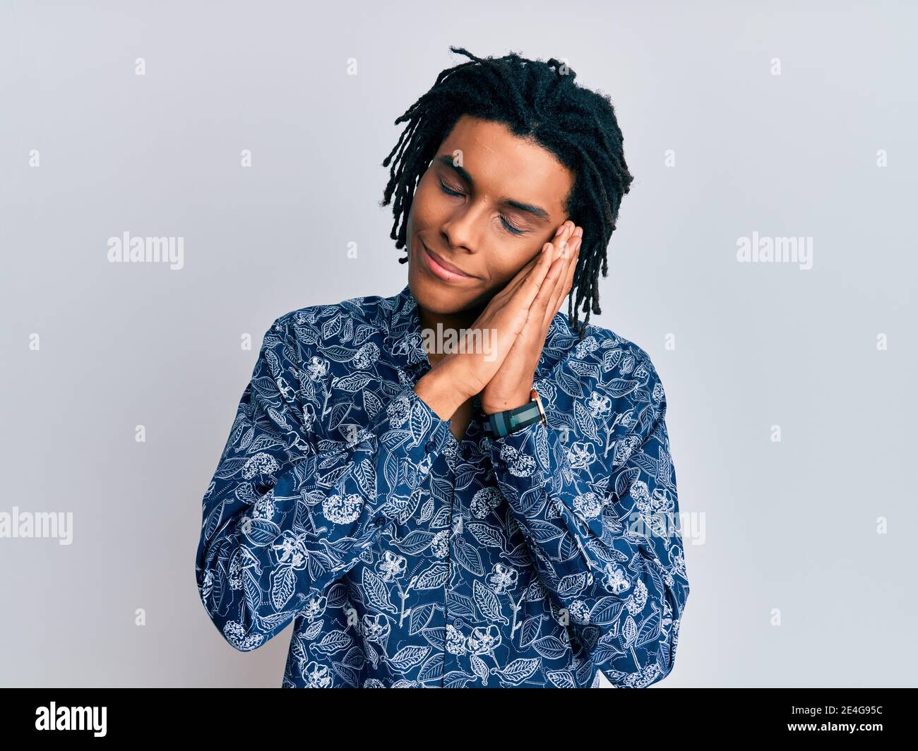 Young african american man wearing 80s style shirt sleeping tired ...
