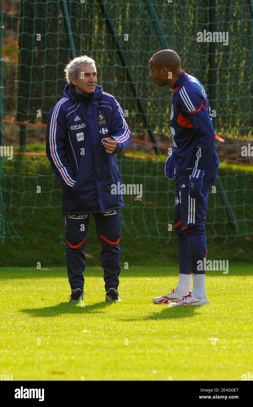 Raymond Domenech speaks with his captain Thierry Henry during a soccer training session of the French National Soccer Team at the 'Centre Technique National' in Clairefontaine, near Paris France on November 13, 2009, ahead of the WC2010 qualifying football match France vs. Ireland scheduled on November 14, 2009 in Dublin. Both France and Ireland finished second in their respective World Cup groups and were drawn first out of the hat in the draw for the two-leg playoffs that will be contested on November 14 and 18. Photo by Henri Szwarc/ABACAPRESS.COM Stock Photo