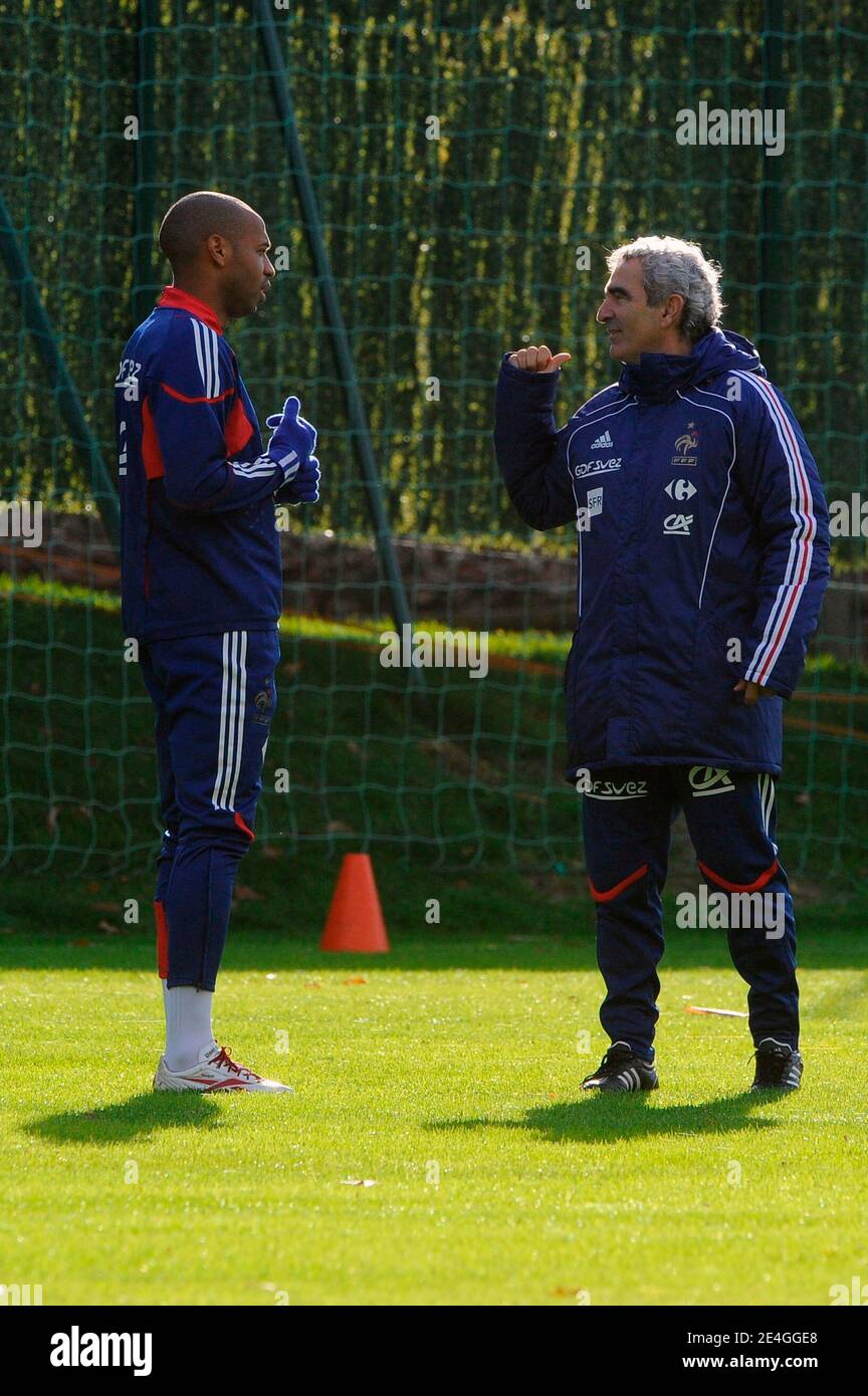 Raymond Domenech speaks with his captain Thierry Henry during a soccer training session of the French National Soccer Team at the 'Centre Technique National' in Clairefontaine, near Paris France on November 13, 2009, ahead of the WC2010 qualifying football match France vs. Ireland scheduled on November 14, 2009 in Dublin. Both France and Ireland finished second in their respective World Cup groups and were drawn first out of the hat in the draw for the two-leg playoffs that will be contested on November 14 and 18. Photo by Henri Szwarc/ABACAPRESS.COM Stock Photo