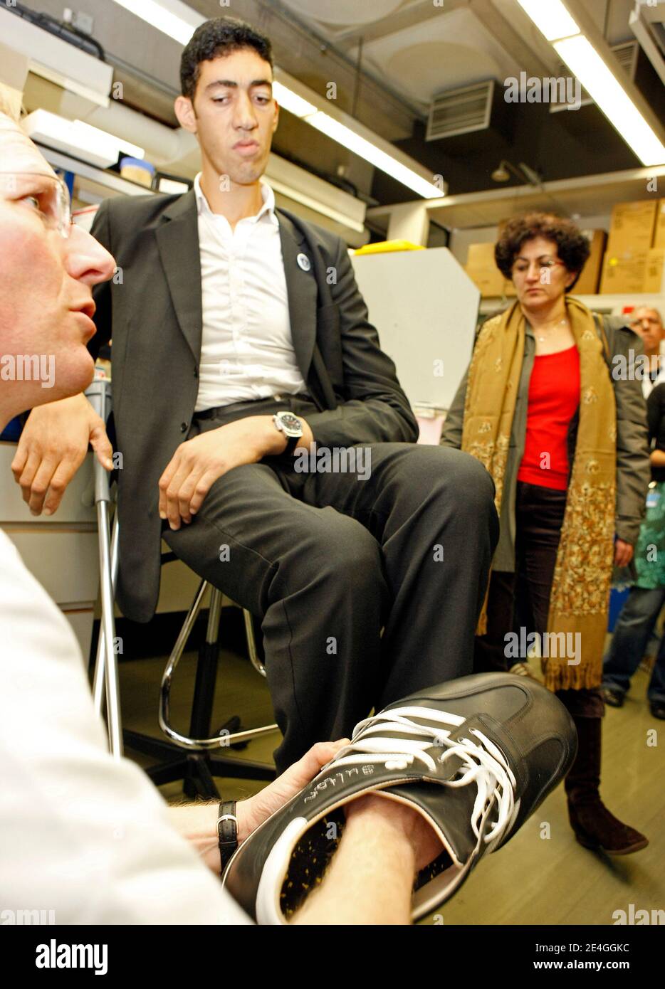 EXCLUSIVE. Turk Sultan Kosen, who is the current record holder of the tallest living man in the world as recognised by Guinness World Records, tries on made-to-measure shoes at Erasmus MC hospital in Rotterdam, The Netherlands on November 9, 2009. The shoes are made by German shoe manufacturer Georg Wessels. Sultan is in Holland as part of a world tour to promote the Guinness Book of Records 2010. Born on September 27, 1982 in eastern Turkey, Sultan is 2,46 m tall et has shoe size 60. Due to his extreme size he never worked. Photo by Alain Gil Gonzales/ABACAPRESS.COM Stock Photo