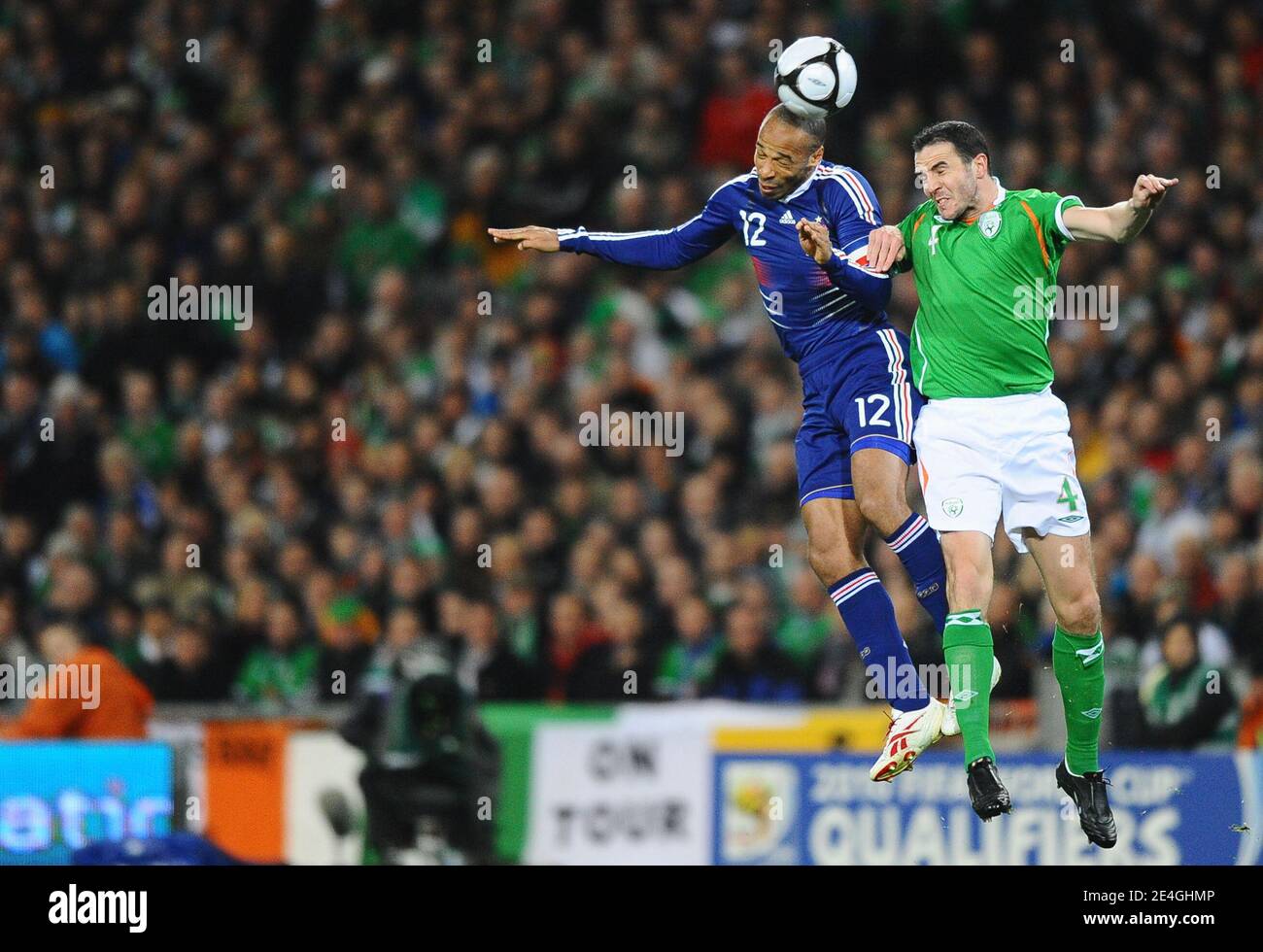 France's Thierry Henry and Ireland's John O'Shea fight for the ball in airs during the World Cup 2010 Qualifying Play off soccer match, Ireland vs France at Croke Park stadium in Dublin, Ireland on November 14, 2009. France won 1-0. Photo by Steeve McMay/ABACAPRESS.COM Stock Photo
