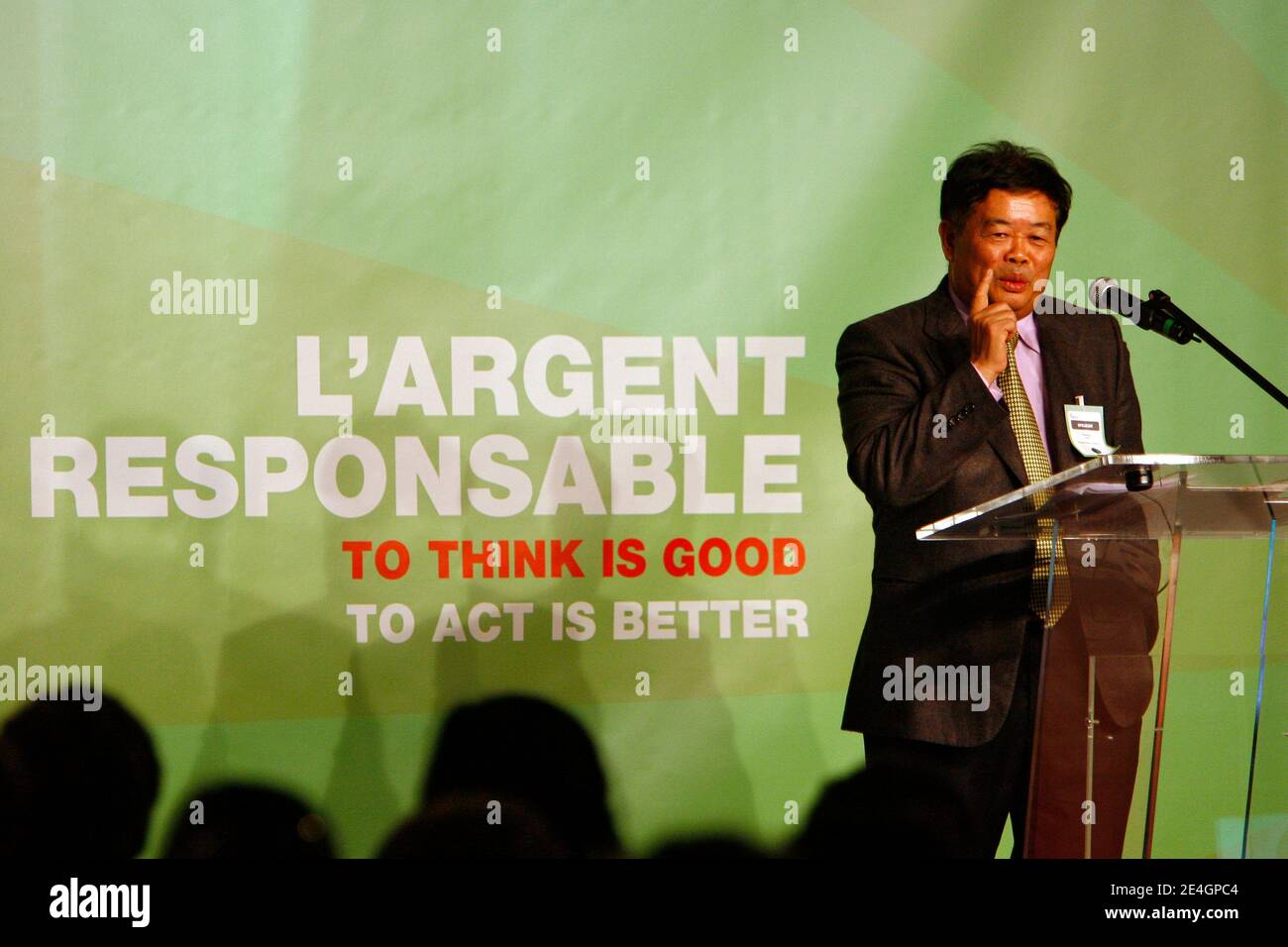 Cao Dewang, CEO of Fuyao Glass Industry Group (China) and Ernst & Young World Entrepreneur of the Year 2009, gestures as he delivers a speech during the closing conference of Economic World Forum, in Lille, France, on Novembre 21, 2009. Photo by Mikael Li Stock Photo