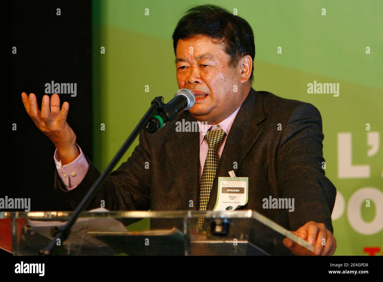 Cao Dewang, CEO of Fuyao Glass Industry Group (China) and Ernst & Young World Entrepreneur of the Year 2009, gestures as he delivers a speech during the closing conference of Economic World Forum, in Lille, France, on Novembre 21, 2009. Photo by Mikael Li Stock Photo