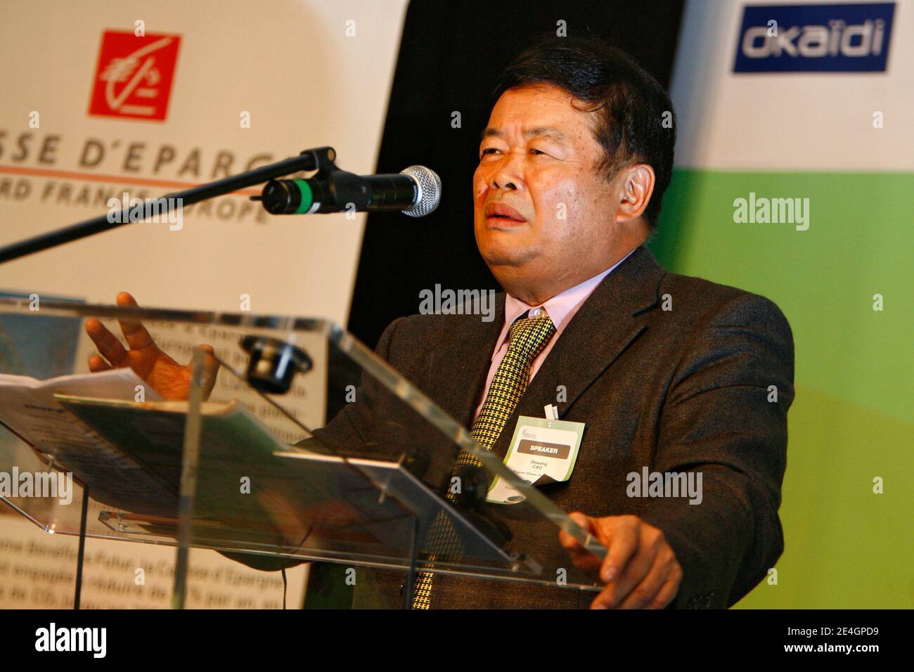 Cao Dewang, CEO of Fuyao Glass Industry Group (China) and Ernst & Young World Entrepreneur of the Year 2009, gestures as he delivers a speech during the closing conference of Economic World Forum, in Lille, France, on Novembre 21, 2009. Photo by Mikael Li Stock Photo