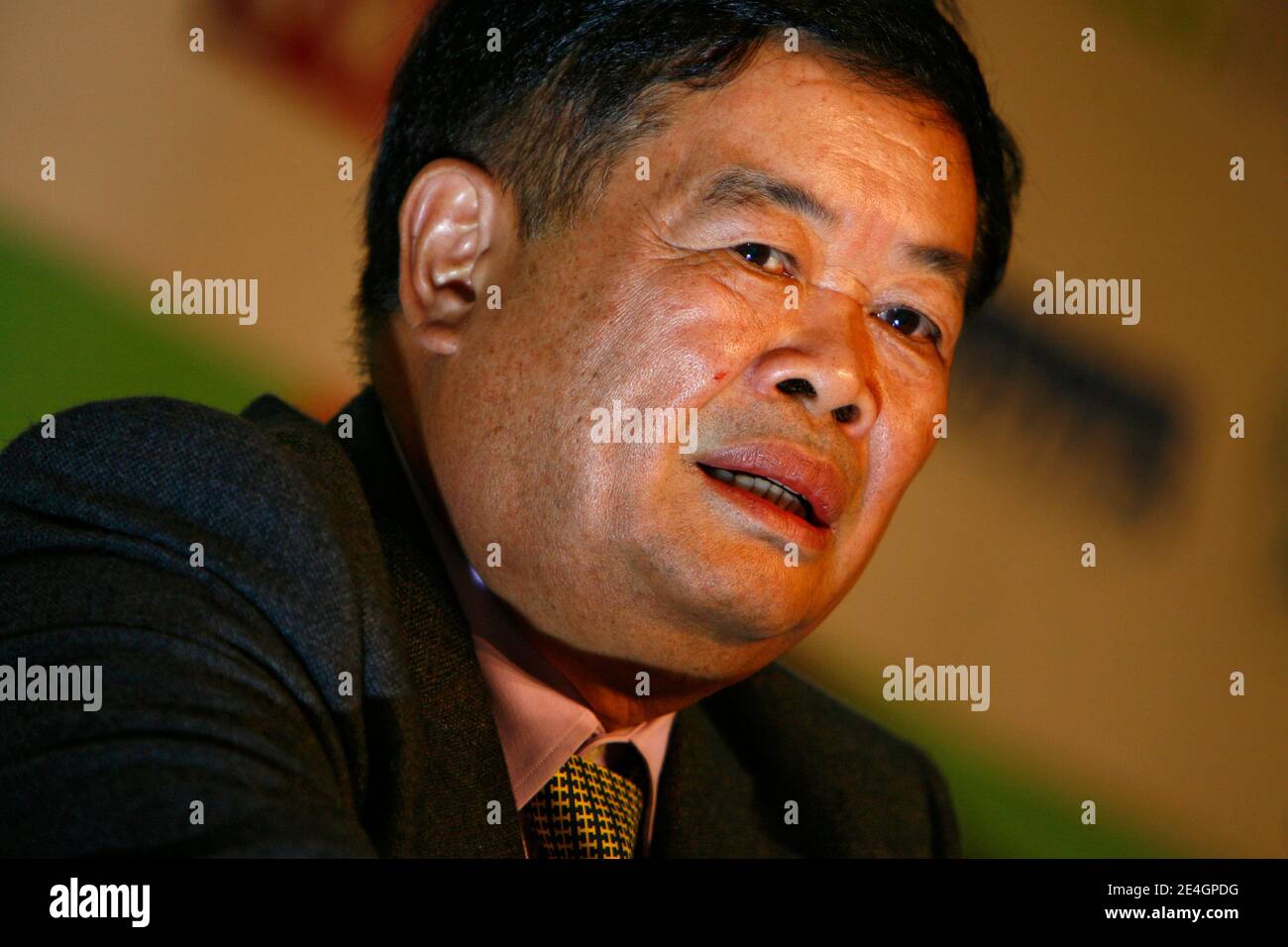 Cao Dewang, CEO of Fuyao Glass Industry Group (China) and Ernst & Young World Entrepreneur of the Year 2009, gestures as he delivers a speech during the closing conference of Economic World Forum, in Lille, France, on Novembre 21, 2009. Photo by Mikael Li Stock Photo