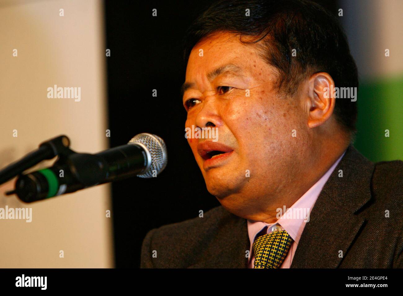 Cao Dewang, CEO of Fuyao Glass Industry Group (China) and Ernst & Young World Entrepreneur of the Year 2009, gestures as he delivers a speech during the closing conference of Economic World Forum, in Lille, France, on Novembre 21, 2009. Photo by Mikael Li Stock Photo