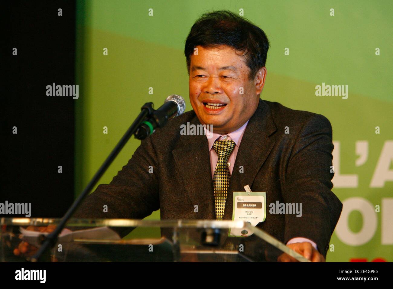 Cao Dewang, CEO of Fuyao Glass Industry Group (China) and Ernst & Young World Entrepreneur of the Year 2009, gestures as he delivers a speech during the closing conference of Economic World Forum, in Lille, France, on Novembre 21, 2009. Photo by Mikael Li Stock Photo