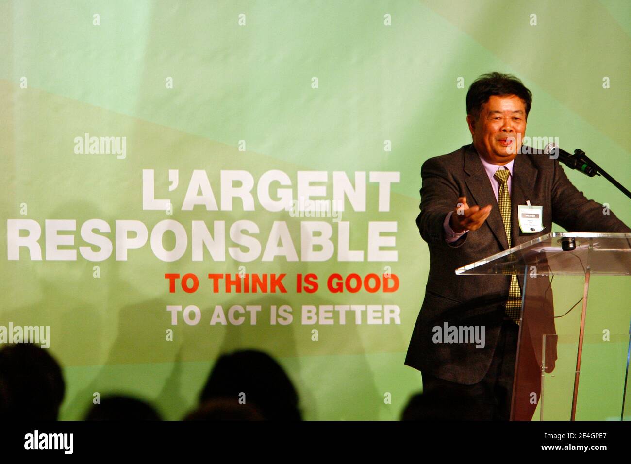 Cao Dewang, CEO of Fuyao Glass Industry Group (China) and Ernst & Young World Entrepreneur of the Year 2009, gestures as he delivers a speech during the closing conference of Economic World Forum, in Lille, France, on Novembre 21, 2009. Photo by Mikael Li Stock Photo