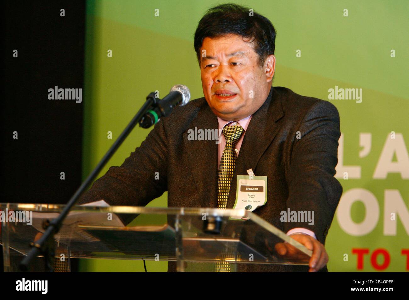 Cao Dewang, CEO of Fuyao Glass Industry Group (China) and Ernst & Young World Entrepreneur of the Year 2009, gestures as he delivers a speech during the closing conference of Economic World Forum, in Lille, France, on Novembre 21, 2009. Photo by Mikael Li Stock Photo