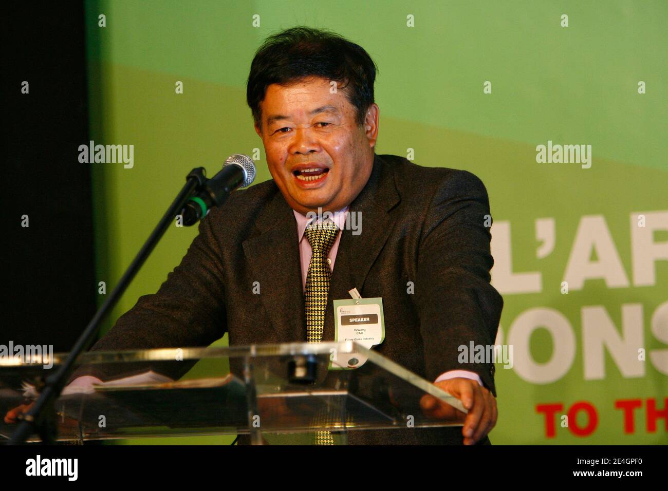 Cao Dewang, CEO of Fuyao Glass Industry Group (China) and Ernst & Young World Entrepreneur of the Year 2009, gestures as he delivers a speech during the closing conference of Economic World Forum, in Lille, France, on Novembre 21, 2009. Photo by Mikael Li Stock Photo