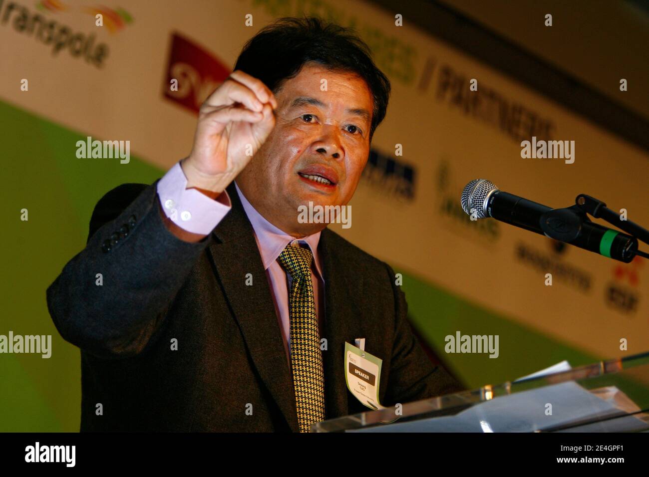 Cao Dewang, CEO of Fuyao Glass Industry Group (China) and Ernst & Young World Entrepreneur of the Year 2009, gestures as he delivers a speech during the closing conference of Economic World Forum, in Lille, France, on Novembre 21, 2009. Photo by Mikael Li Stock Photo