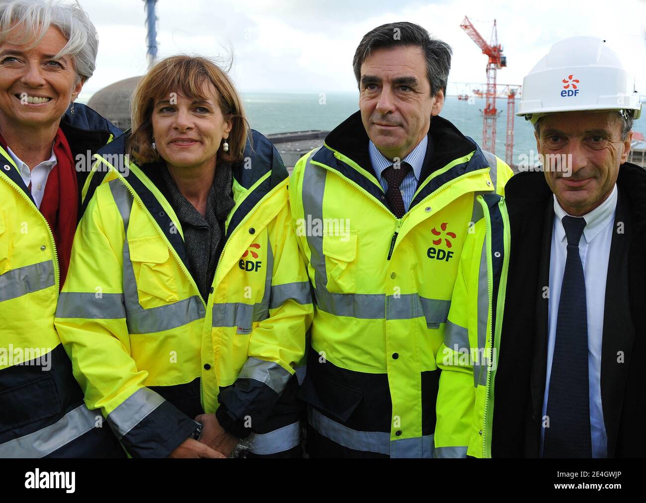 French Prime Minister Francois Fillon flanked by Minister for the Economy, Finance and Employment Christine Lagarde, Nuclear engineering giant Areva chairwoman Anne Lauvergeon and New chief executive of state-controlled Electricite de France, Henri Proglio visits the construction site of the third-generation European Pressurised Water nuclear Reactor (EPR) in Flamanville, western France, on November 26, 2009. Photo by Nicolas Gouhier/ABACAPRESS.COM Stock Photo