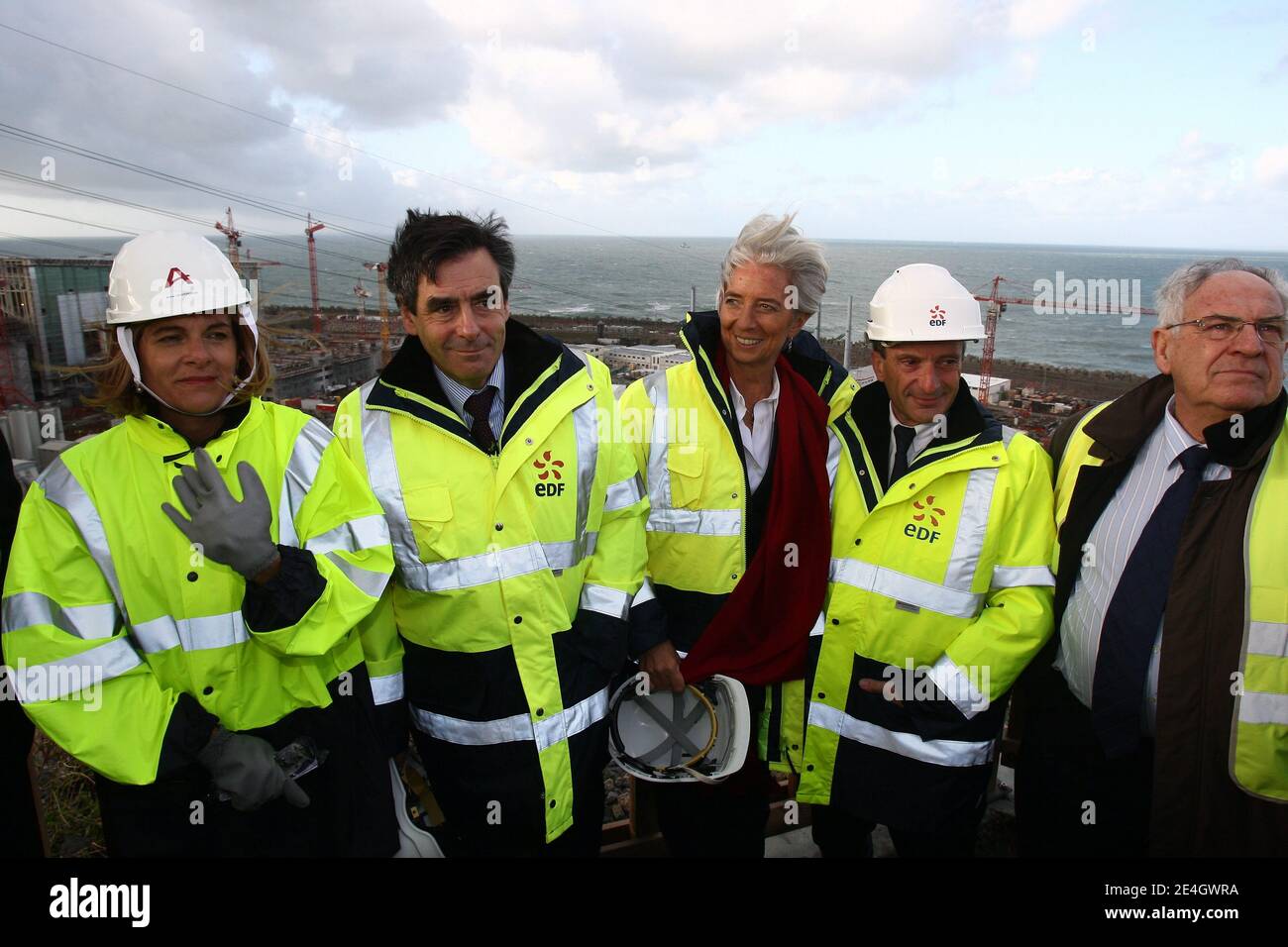 French Prime Minister Francois Fillon flanked by Nuclear engineering giant Areva chairwoman Anne Lauvergeon, Minister for the Economy, Finance and Employment Christine Lagarde and New chief executive of state-controlled Electricite de France, Henri Proglio visits the construction site of the third-generation European Pressurised Water nuclear Reactor (EPR) in Flamanville, western France, on November 26, 2009. Photo by Ludovic/Pool/ABACAPRESS.COM Stock Photo