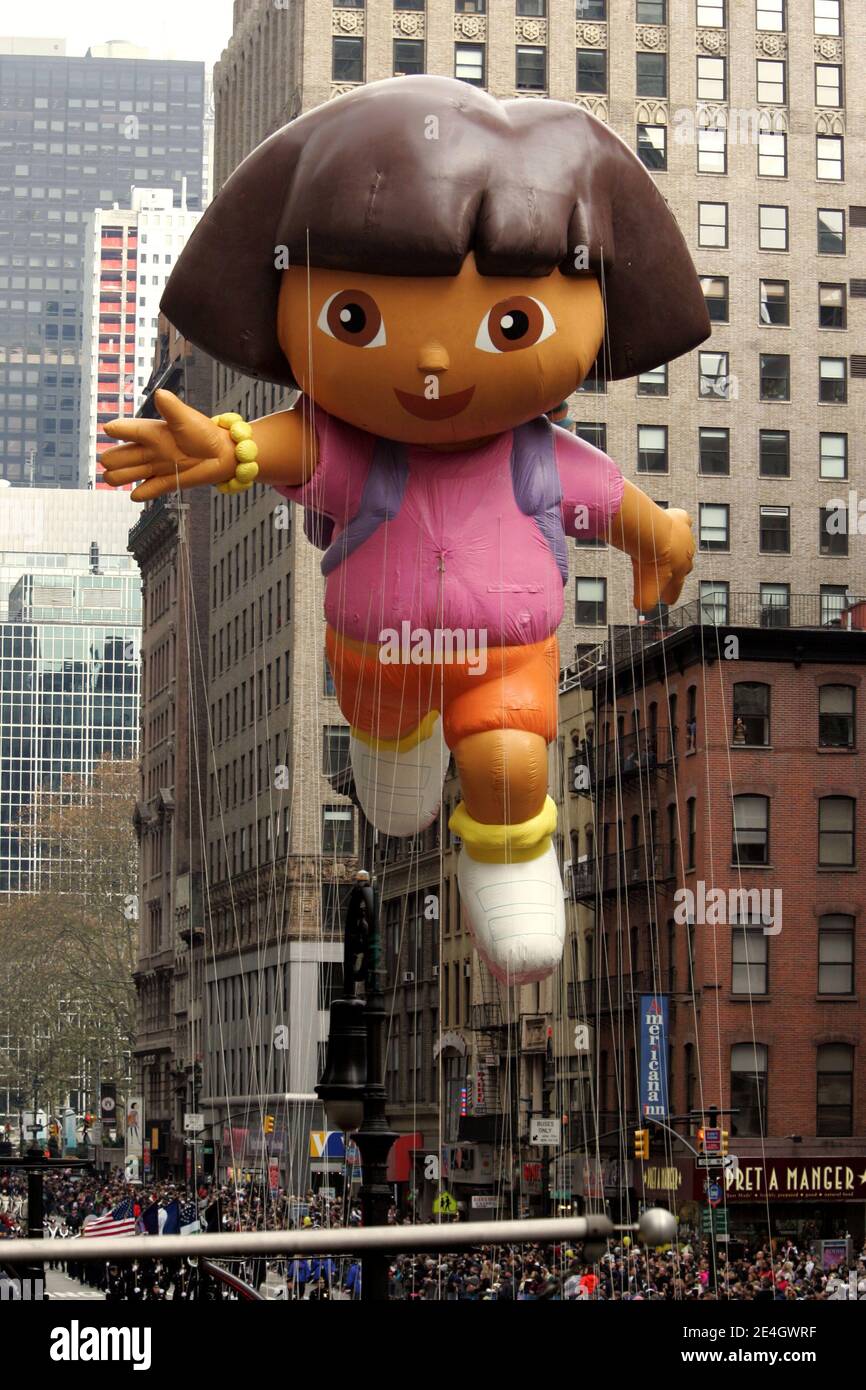 The Dora the Explorer balloon hovers in between Manhattan high rises during the 83rd annual Macy's Thanksgiving Day parade on the Streets of Manhattan on November 26, 2009 in New York City. Photo by Charles Guerin/ABACAPRESS.COM Stock Photo