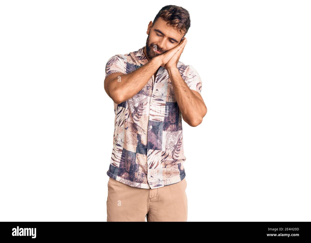 Young hispanic man wearing summer clothes sleeping tired dreaming and ...