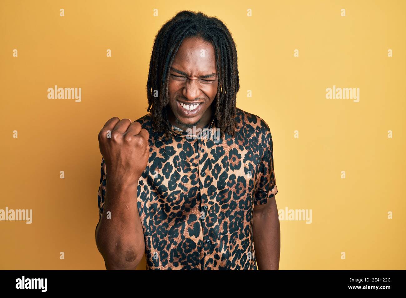 African american man with braids wearing leopard animal print shirt ...