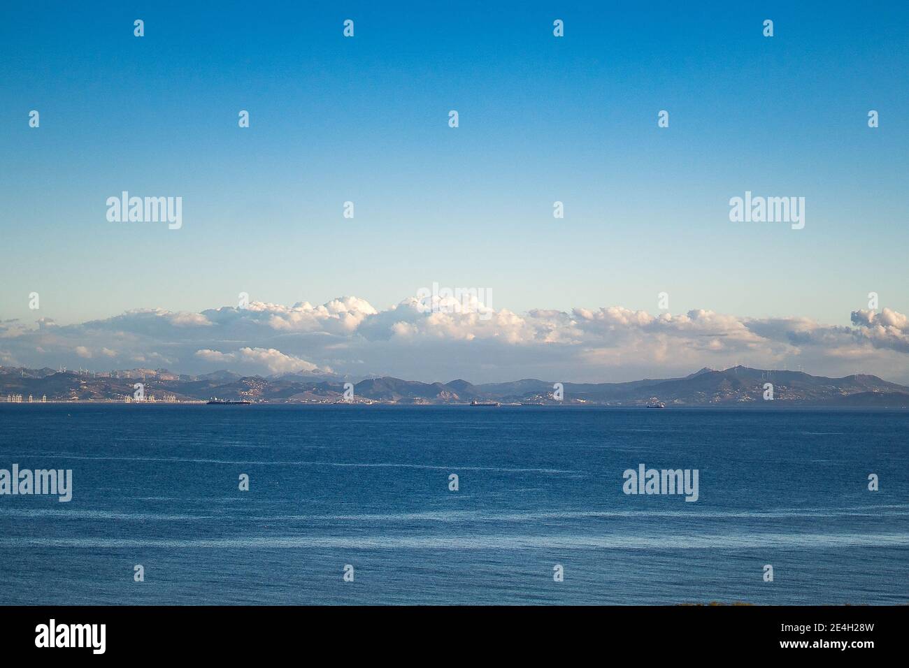 Beautiful view of the sea under cloudy blue sky Stock Photo - Alamy