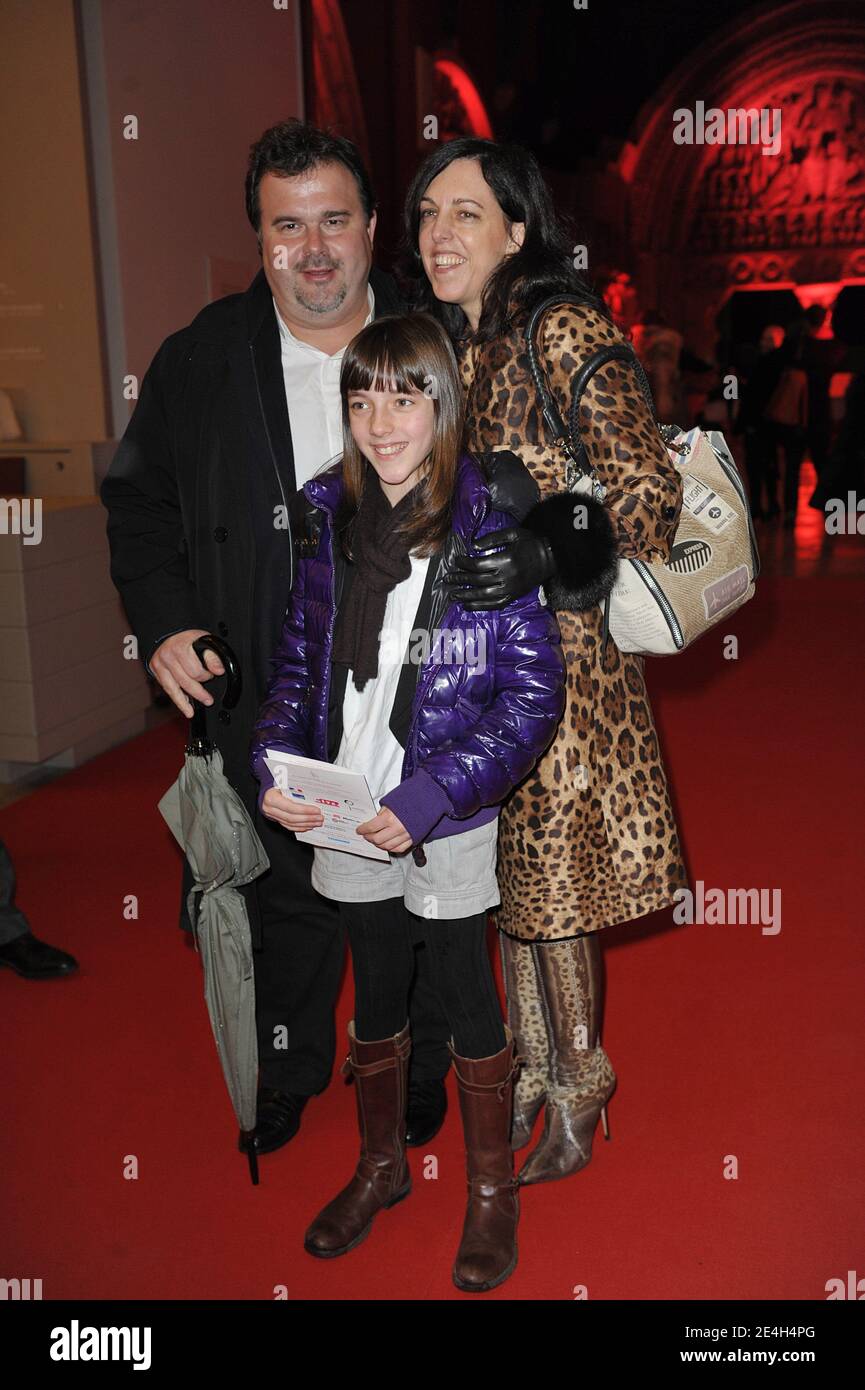 'Pierre herme pose with wife and daughter as they attend auction sale of fashion designers' Christmas trees, organised for the benefit of '' L'enfant a l'Hospital '' association by Carla Bruni-Sarkozy at the Cite de l'Architecture in Paris, France, on December 8, 2009. Photo by Giancarlo Gorassini/ABACAPRESS.COM' Stock Photo