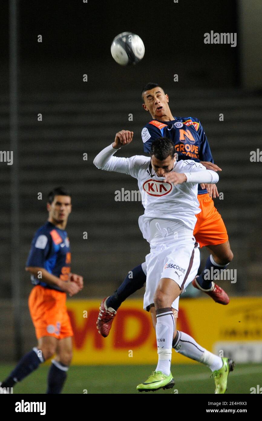 Montpellier's Younes Belhanda battles for the ball with Bordeaux's Marouane  Chamakh during French First League soccer match, Montpellier vs Girondins  de Bordeaux in Montpellier, France on December 16, 2009. Bordeaux won 1-0.