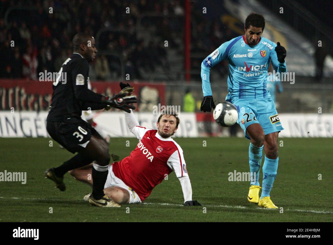 Valenciennes Goal Keeper Guy Assembe Ndy And Jacques Abardonado Fight For The Ball With Lens Issam Jemaa During The French First League Soccer Match Between Valenciennes Fc Vafc And Racing Club De Valenciennes Goal Keeper Guy Assembe Ndy And Jacques Abardonado Fight For The Ball With Lens Issam Jemaa During The French First League Soccer Match Between Valenciennes Fc Vafc And Racing Club De