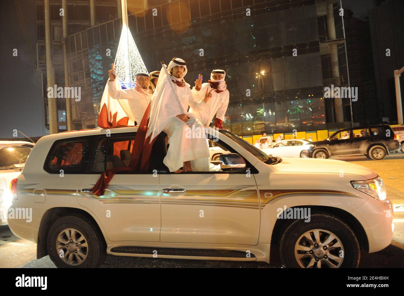 Qatari people decorate their 4wheeldrive cars with hearts, flags