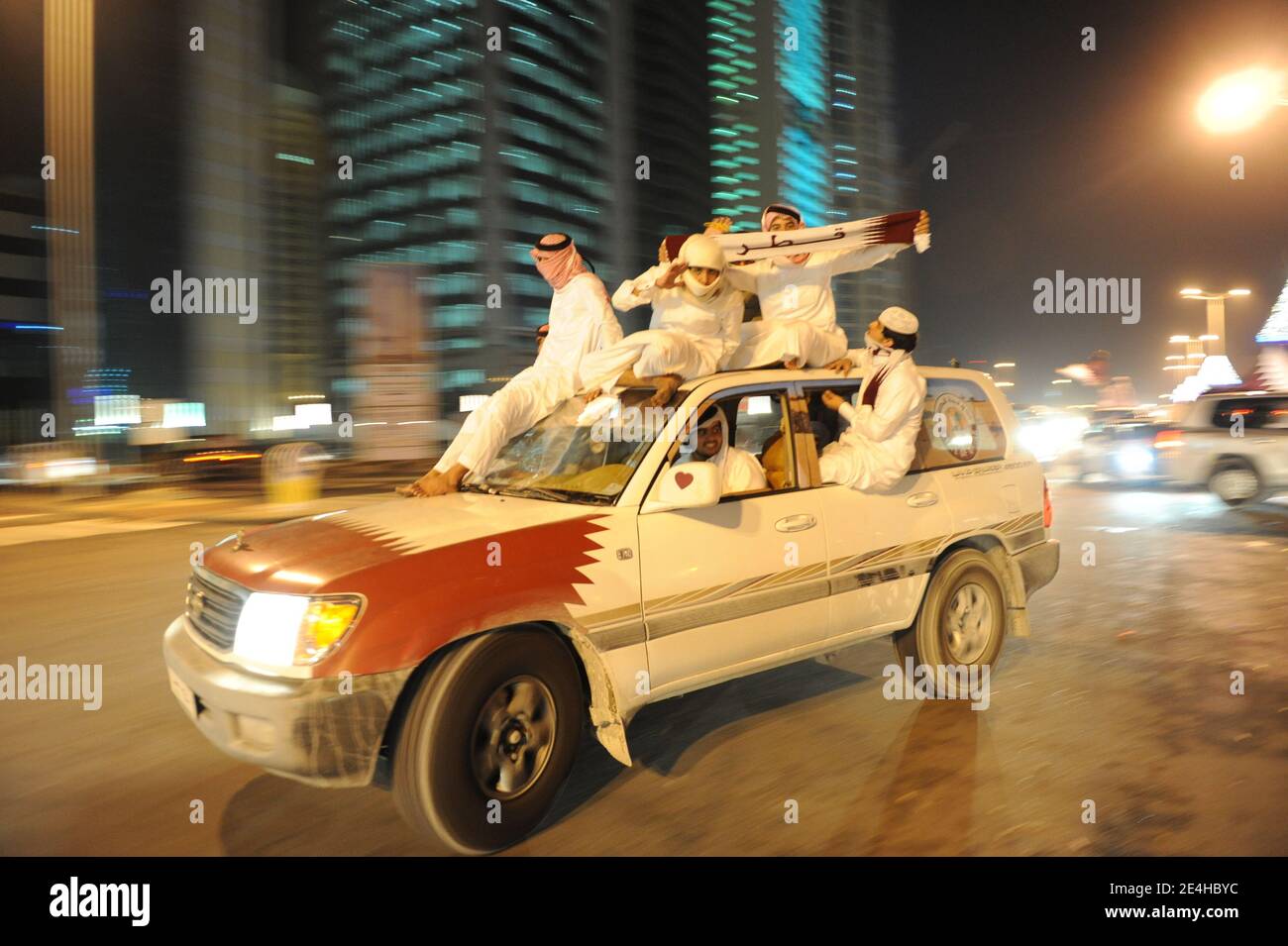 Qatari people decorate their 4wheeldrive cars with hearts, flags