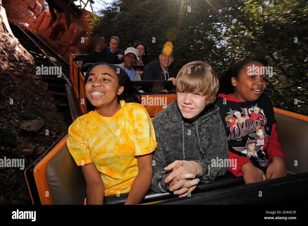 Canadian Pop Singer Justin Bieber C Rides The Big Thunder Mountain Railroad With Lucky Radio Disney Listener Nine Year Old Rebekah Parker R And Sister Rachel Parker At Epcot Fl Usa On December 19