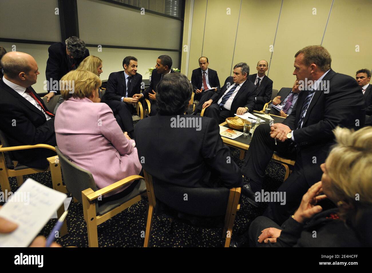 European Commission President Jose Manuel Barroso, German Chancellor Angela Merkel, Sweden's prime minister and standing president of the European Council, Fredrik Reinfeldt, French President Nicolas Sarkozy, US President Barack Obama and British Prime Minister Gordon Brown, Danish Prime Minister Lars Lokke Rasmussen and behind French Minister for Ecology, Energy, Sustainable Development and Climate Change Negotiations Jean-Louis Borloo, French President's advisor Olivier Colom attend a meeting at the Bella Center in Copenhagen, Denmark on December 18, 2009 during COP15 UN Climate Change Confe Stock Photo