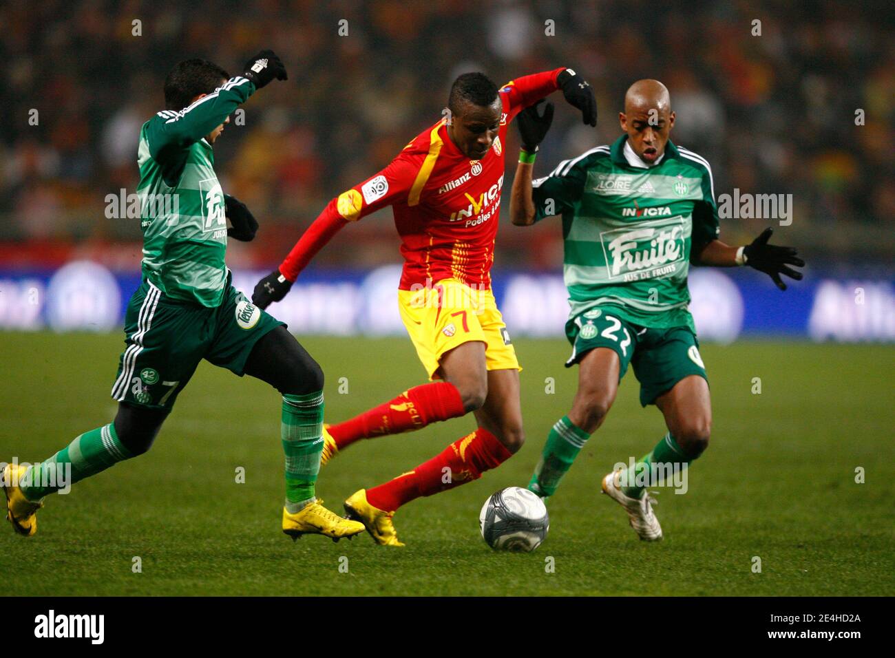 Lens' Razak Boukari fights for the ball with St-Etienne's Gelson Fernandes  Tavares (R) and Dimitri Payet during the French First League Soccer match, RC  Lens vs AS Saint-Etienne at Felix Bollaert Stadium