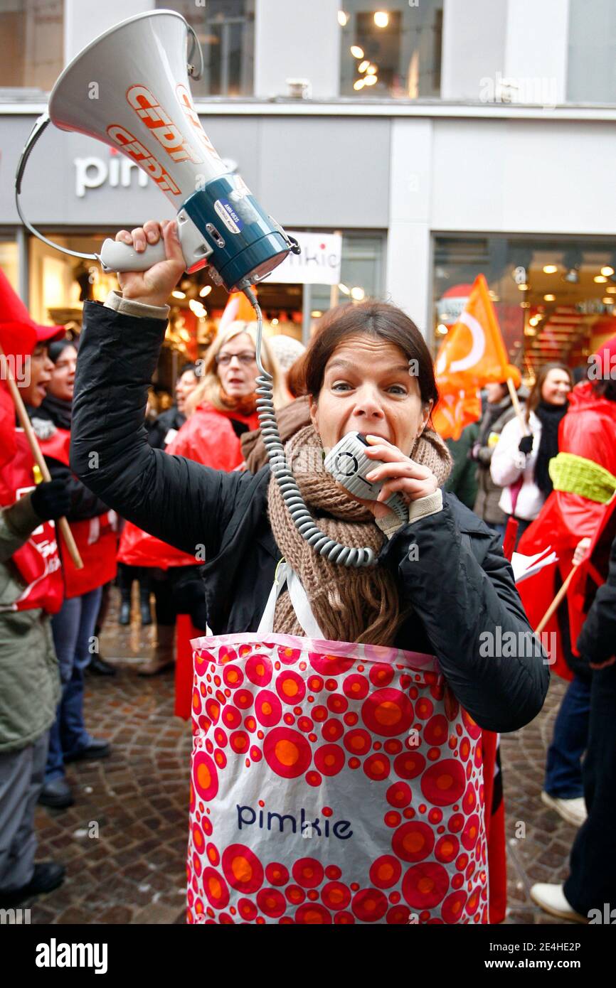 Around 60 employees of clothing plant Pimkie (Mulliez Group) demonstrate to  protest lay-offs and to ask for severance pays, on the streets and in front  of a Pimkie store, in Lille, northern