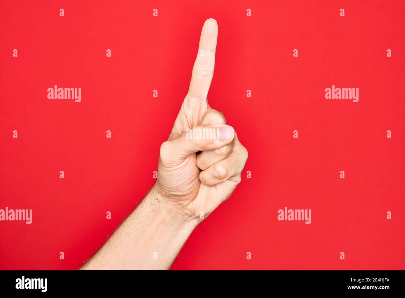 Hand of caucasian young man showing fingers over isolated red ...