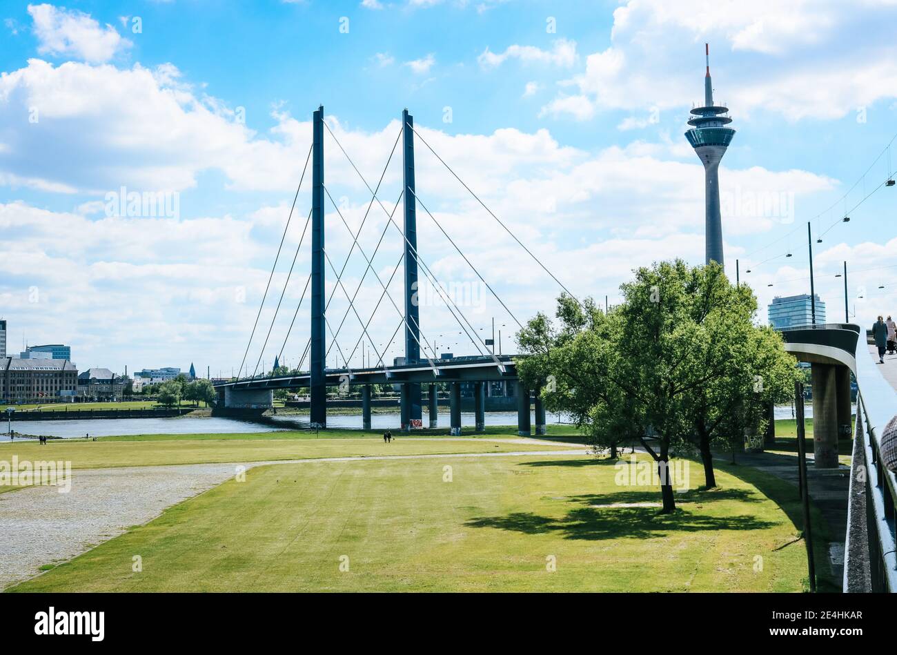 Landscape of Oberkasseler bridge and the Television Transmission Tower in Düsseldorf, Germany on a sunny summer day Stock Photo