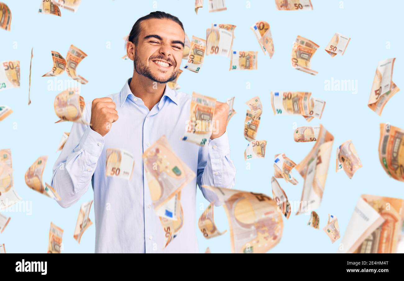 Young handsome man wearing business clothes excited for success with ...