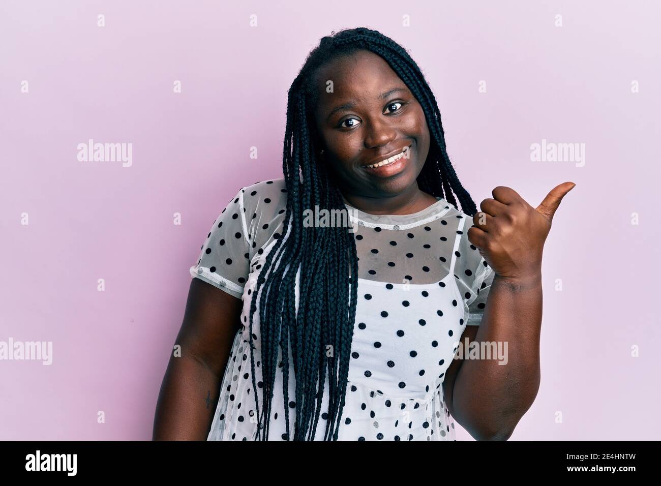 Young black woman with braids wearing casual clothes smiling with happy ...