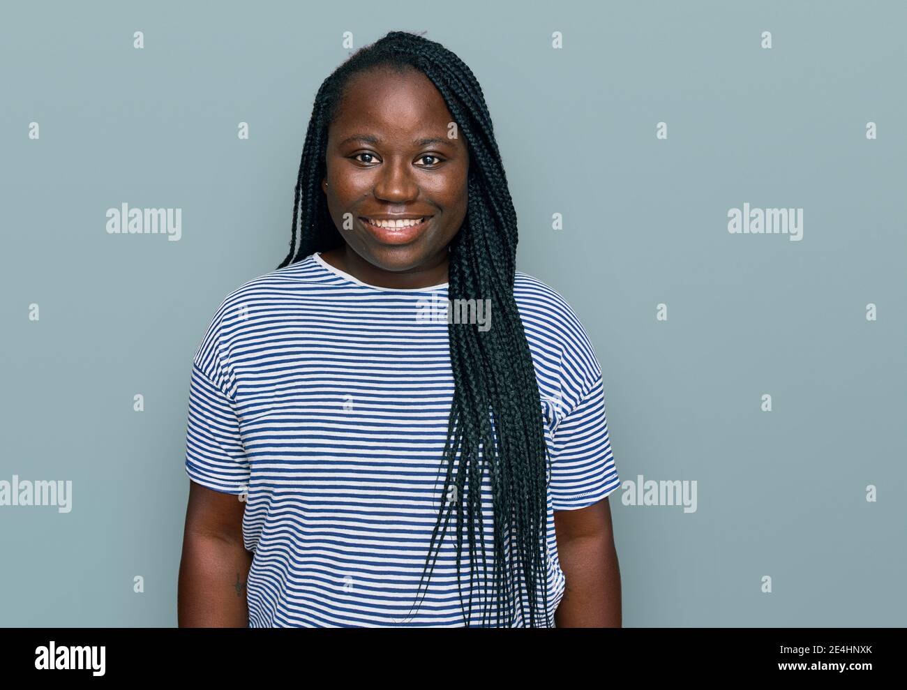 Young black woman with braids wearing casual clothes with a happy and ...