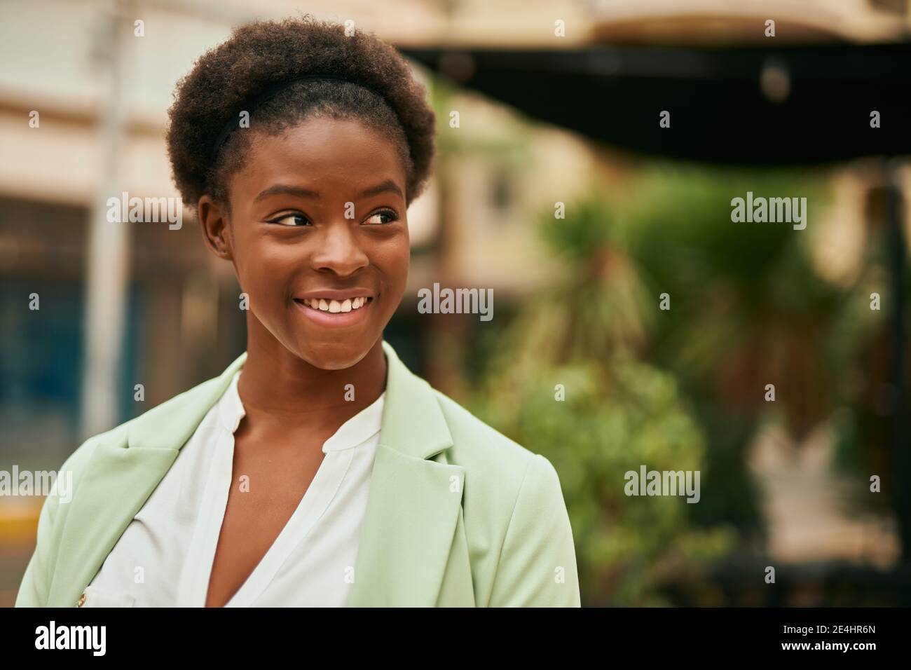 Young african american businesswoman smiling happy standing at the city ...