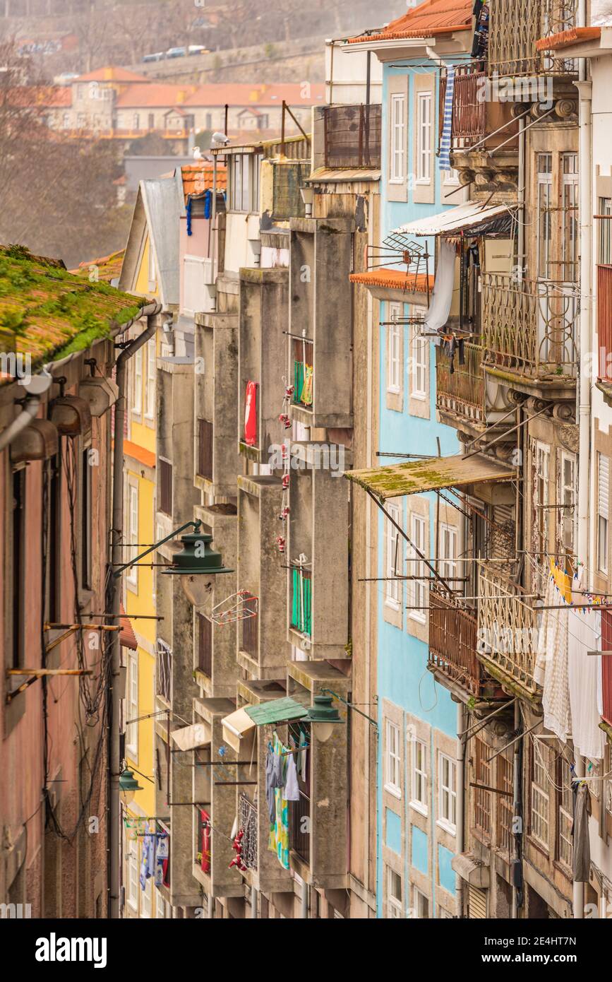 Colorful houses of Porto Ribeira traditional facades old multicolored houses, Dom luis bridge and historic tram. Porto, Portugal . January 2021 Stock Photo