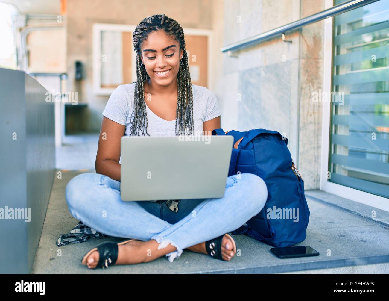 Young african american student woman smiling happy using computer ...
