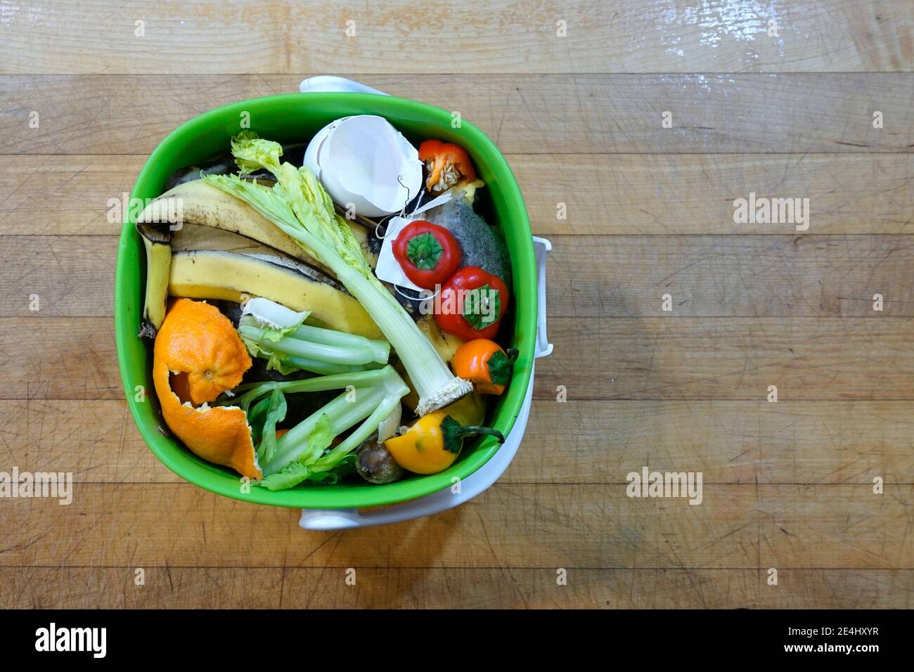 Top-view of kitchen scraps in a container ready for composting Stock Photo