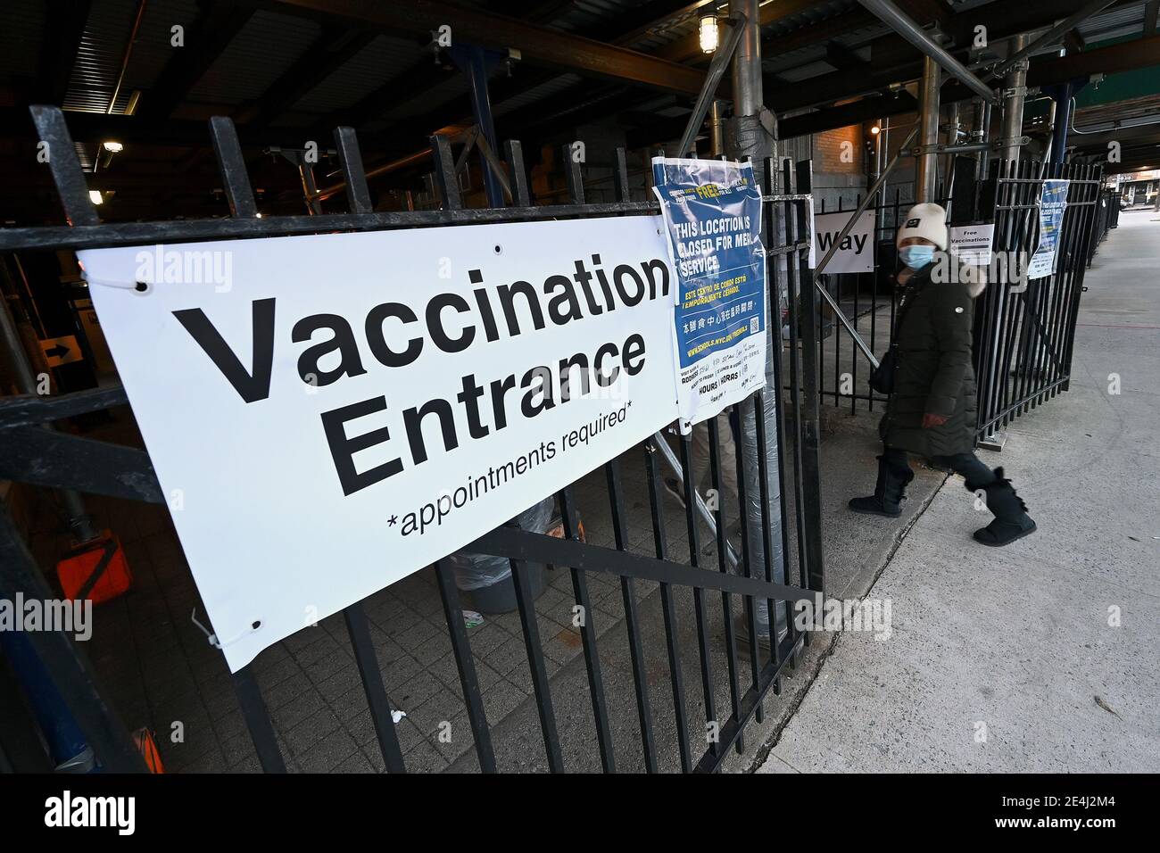 A woman enters a COVID-19 Vaccination Hub in the Elmhurst section of the Queens borough of New York City, NY, January 23, 2021. New York City has ordered 15 if its COVID-19 Vaccinations hubs closed and appointments cancelled due to a shortage of the COVID-19 vaccine; the United States recently surpassed 400,000 deaths due to Coronavirus infections.  (Photo by Anthony Behar/Sipa USA) Stock Photo